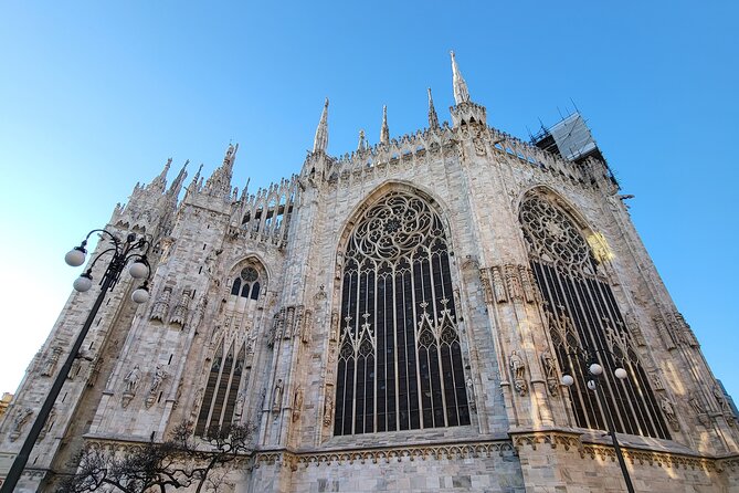 Cathedral & Skyline: Duomo di Milano Tour with Rooftop Access - Duomo di Milano interior: stained glass, marble, and the stories behind it