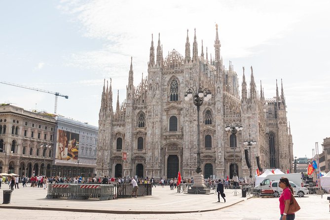 Milan Super Saver: Skip-the-Line Duomo and Rooftop Guided Tour - Inside the Duomo: facade sculpture, stained glass, and the “hidden corners” effect